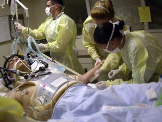 040723-N-8977L-008
Los Angeles, Calif. (July 23, 2004) - Navy Hospital Corpsmen and Medical Officers assess the treatment and prognosis of a patient with a gunshot wound to the head in the Intensive Care Unit (ICU) at the Los Angeles County, University of Southern California (USC) Medical Center. The students are part of an outreach cooperative training program between Navy Medicine and the medical center. The Naval Trauma Training CenterÕs (NTTC) mission is to provide trauma experience and knowledge to Naval medical personnel before they deploy. The students from Naval Hospitals, clinics and commands at Naval Installations around the world, work in the emergency room, operating room and intensive care unit, to learn about the wide range of situations they may encounter when sent into the field. U.S. Navy photo by PhotographerÕs Mate 2nd Class Johansen Laurel (RELEASED)